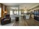 Bright open concept living space and kitchen area, featuring hardwood floors and modern appliances at 19187 Outer Bank Rd, Noblesville, IN 46062