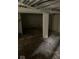 View of an unfinished basement with a concrete floor and support beam at 1943 N Drexel Ave, Indianapolis, IN 46218