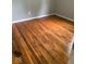 Bedroom with hardwood floors, baseboard trim, and natural light at 1943 N Drexel Ave, Indianapolis, IN 46218
