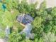 Beautiful aerial view of home situated on a wooded lot with a private driveway and surrounding greenery at 2004 Layton Rd, Anderson, IN 46011