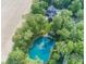 Breathtaking view of home and pond, showcasing its secluded setting and lush landscaping at 2004 Layton Rd, Anderson, IN 46011