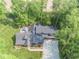 Aerial view of estate featuring a large home, long driveway, and picturesque landscaping at 2004 Layton Rd, Anderson, IN 46011