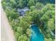 Expansive estate with a luxurious home, three-car garage, and lush surroundings, as seen from above at 2004 Layton Rd, Anderson, IN 46011