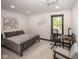 Comfortable bedroom featuring a dedicated work space with natural light streaming through the window at 2004 Layton Rd, Anderson, IN 46011