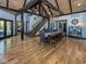 Dining room with exposed beams, hardwood floors, and staircase at 2004 Layton Rd, Anderson, IN 46011