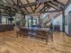 Living room with stone fireplace, dining area, and exposed beams at 2004 Layton Rd, Anderson, IN 46011
