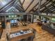 Open-concept living space with exposed beams, island kitchen, and dining area at 2004 Layton Rd, Anderson, IN 46011