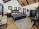 Main bedroom featuring a chandelier, hardwood floors, and neutral decor at 2004 Layton Rd, Anderson, IN 46011