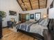 Main bedroom with hardwood floors, chandelier, and natural light at 2004 Layton Rd, Anderson, IN 46011