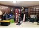 A cluttered basement space shows wood paneling and assorted items at 2032 N Auburn St, Speedway, IN 46224