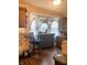 Functional kitchen with ample counter space, vintage wallpaper and hanging pots at 2032 N Auburn St, Speedway, IN 46224