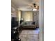 Inviting living room featuring neutral tones, ceiling fan and laminate floors at 2032 N Auburn St, Speedway, IN 46224