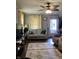 Cozy living room with gray sofa, area rugs and natural light at 2032 N Auburn St, Speedway, IN 46224