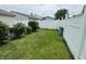 Lush, green backyard with a well-maintained lawn and privacy fence at 2302 Rolling Oak Dr, Indianapolis, IN 46214