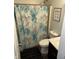 Bathroom with a colorful curtain and modern fixtures with decorative nautical themed shower curtain at 2302 Rolling Oak Dr, Indianapolis, IN 46214