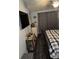 Bedroom with mounted TV, nautical decor, and a comfortable bed with a patterned comforter at 2302 Rolling Oak Dr, Indianapolis, IN 46214