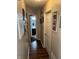 Hallway with a view of the bathroom and framed pictures on the wall at 2302 Rolling Oak Dr, Indianapolis, IN 46214