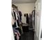 Walk-in closet with ample hanging space and built in black dresser storage at 2302 Rolling Oak Dr, Indianapolis, IN 46214
