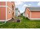 View of the backyard featuring neighboring buildings and detached garage at 2326 N Pennsylvania St # 6, Indianapolis, IN 46205