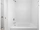 Clean bathroom featuring white tiled bathtub and shower at 2326 N Pennsylvania St # 6, Indianapolis, IN 46205