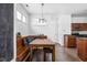 Charming breakfast nook featuring wooden bench seating and a view of the kitchen at 2326 N Pennsylvania St # 6, Indianapolis, IN 46205