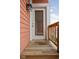 Exterior view of a wood deck and a full glass door with white trim at 2326 N Pennsylvania St # 6, Indianapolis, IN 46205