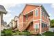 Charming townhome featuring colorful siding, wooden stairs and trim, and a well-maintained front yard at 2326 N Pennsylvania St # 6, Indianapolis, IN 46205