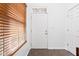 Bright entryway featuring a modern white door and sleek tiled flooring at 2326 N Pennsylvania St # 6, Indianapolis, IN 46205