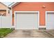 Detached two-car garage with a new white door, matching the trim and siding of the house at 2326 N Pennsylvania St # 6, Indianapolis, IN 46205