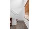 Entry hallway featuring tile floor, wooden stairs and lots of natural light at 2326 N Pennsylvania St # 6, Indianapolis, IN 46205
