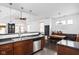 Open-concept kitchen with a stainless steel dishwasher and view into the Gathering room at 2326 N Pennsylvania St # 6, Indianapolis, IN 46205