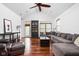 Bright living room featuring hardwood floors, vaulted ceilings, and abundant natural light at 2326 N Pennsylvania St # 6, Indianapolis, IN 46205