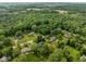 An aerial view showing the surrounding lush green tree landscape at 233 Saddlebrook Dr, Zionsville, IN 46077