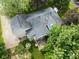 Aerial view of roof, deck, landscaping, and large trees on private lot at 233 Saddlebrook Dr, Zionsville, IN 46077