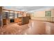 Spacious finished basement with wood floors, built-in shelving, and a wet bar for entertaining at 233 Saddlebrook Dr, Zionsville, IN 46077