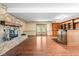 Spacious basement featuring a stone fireplace and a custom bar at 233 Saddlebrook Dr, Zionsville, IN 46077