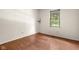 Bright bedroom with hardwood floors features natural light from the large window at 233 Saddlebrook Dr, Zionsville, IN 46077
