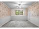 Bedroom features carpet, floral wallpaper, wainscoting, and a window for natural light at 233 Saddlebrook Dr, Zionsville, IN 46077
