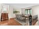 Open dining room with natural light and a view of the staircase at 233 Saddlebrook Dr, Zionsville, IN 46077