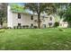 Charming two-story home with a manicured lawn and mature trees at 233 Saddlebrook Dr, Zionsville, IN 46077