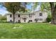 Charming two-story home with a manicured lawn and mature trees at 233 Saddlebrook Dr, Zionsville, IN 46077