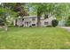 Two story home with inviting front entrance and lush lawn at 233 Saddlebrook Dr, Zionsville, IN 46077
