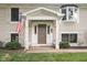 Inviting front entrance with an American flag at 233 Saddlebrook Dr, Zionsville, IN 46077