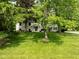 Charming two-story home featuring a well-manicured lawn and mature trees at 233 Saddlebrook Dr, Zionsville, IN 46077