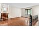 Open living room with hardwood floors and abundant natural light at 233 Saddlebrook Dr, Zionsville, IN 46077