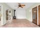 Enclosed sunroom featuring tile floor, a wood burning stove, and access to the exterior at 233 Saddlebrook Dr, Zionsville, IN 46077