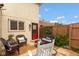 Serene backyard patio setting with cozy wicker furniture and lush greenery, perfect for outdoor relaxation at 2766 Del Prado Dr # 6, Indianapolis, IN 46227