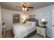 Inviting bedroom with wallpaper accent wall, soft bedding, and plenty of natural light at 2766 Del Prado Dr # 6, Indianapolis, IN 46227