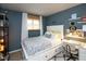 Stylish bedroom featuring a white desk area and a comfortable bed with storage drawers at 2766 Del Prado Dr # 6, Indianapolis, IN 46227