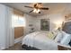Comfortable bedroom with soft lighting, neutral decor, and a window with bamboo shade at 2766 Del Prado Dr # 6, Indianapolis, IN 46227